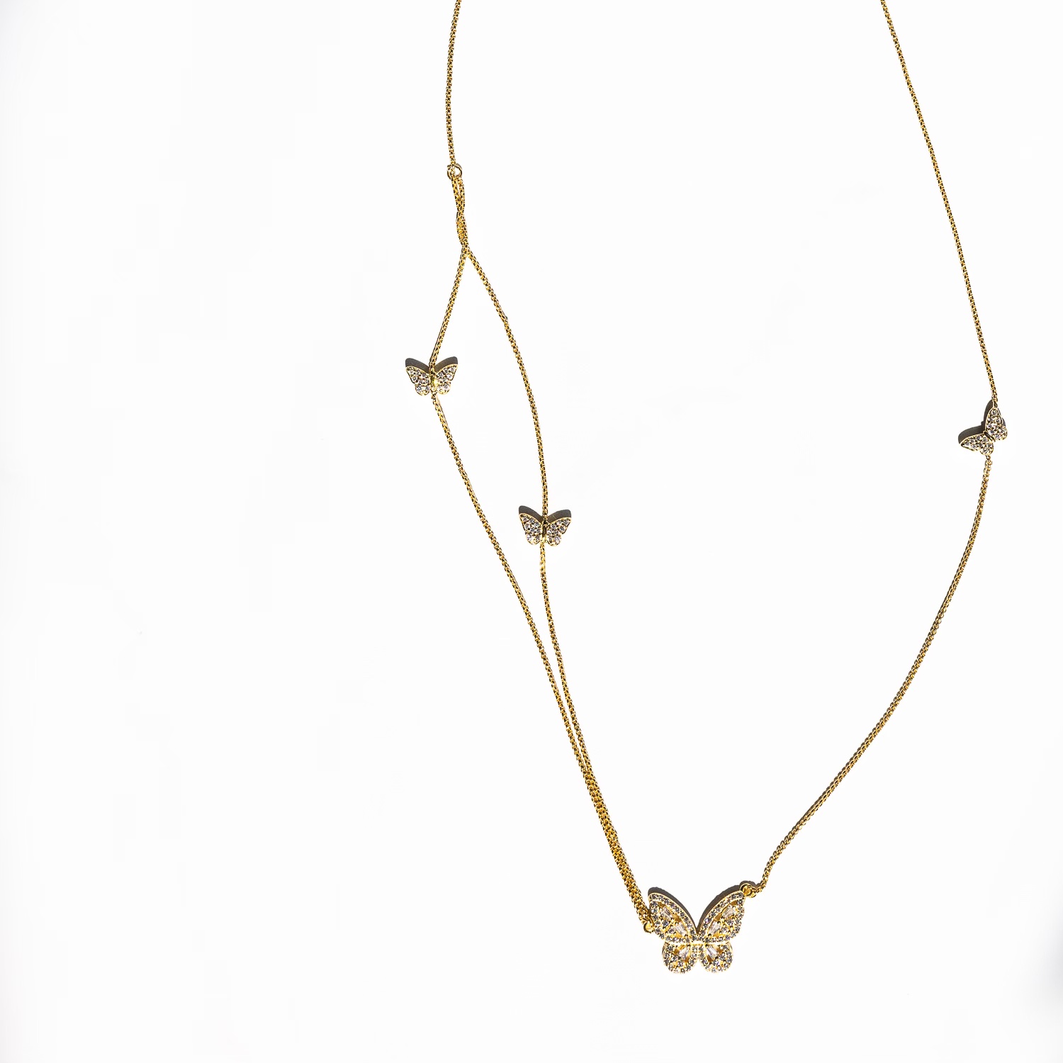 The "Beaming Butterfly Necklace in Gold" on a white background.