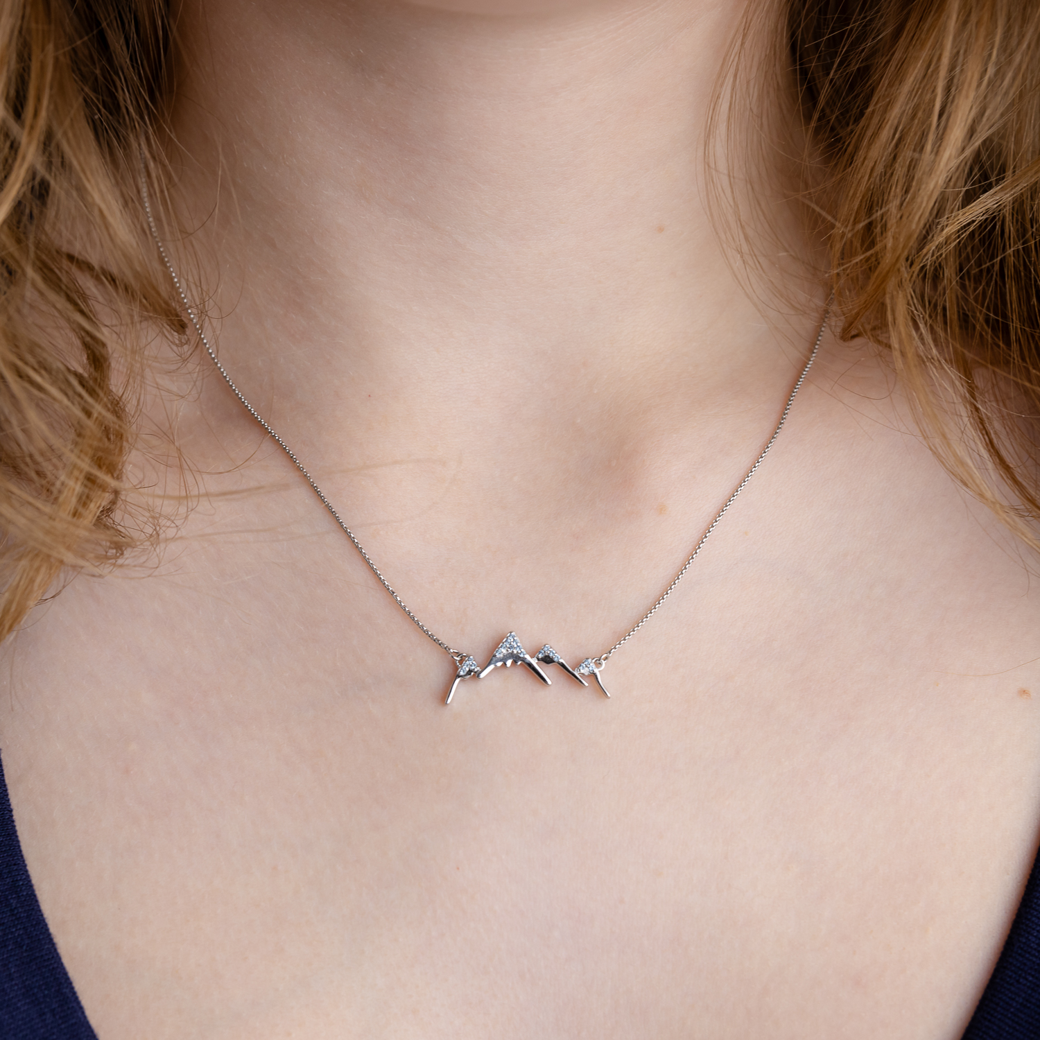 A teen girl wearing the "Magical Mountain Necklace".