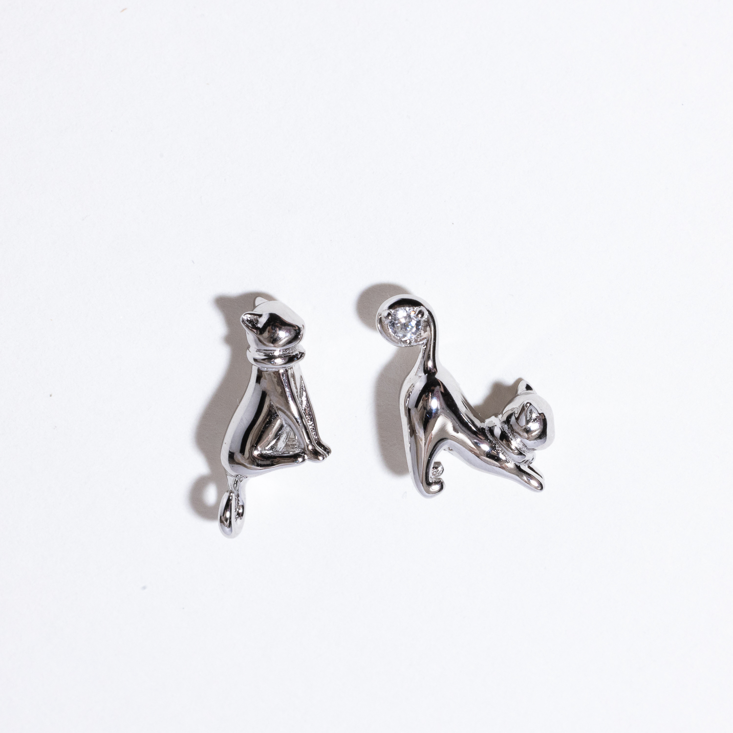 A white background with the "Cool Cat Earrings" in silver.