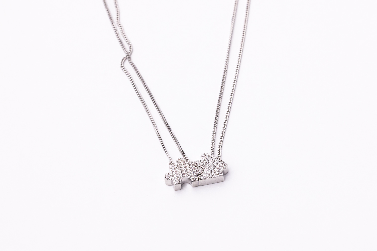 Two of the "Puzzle Piece Necklace" together.